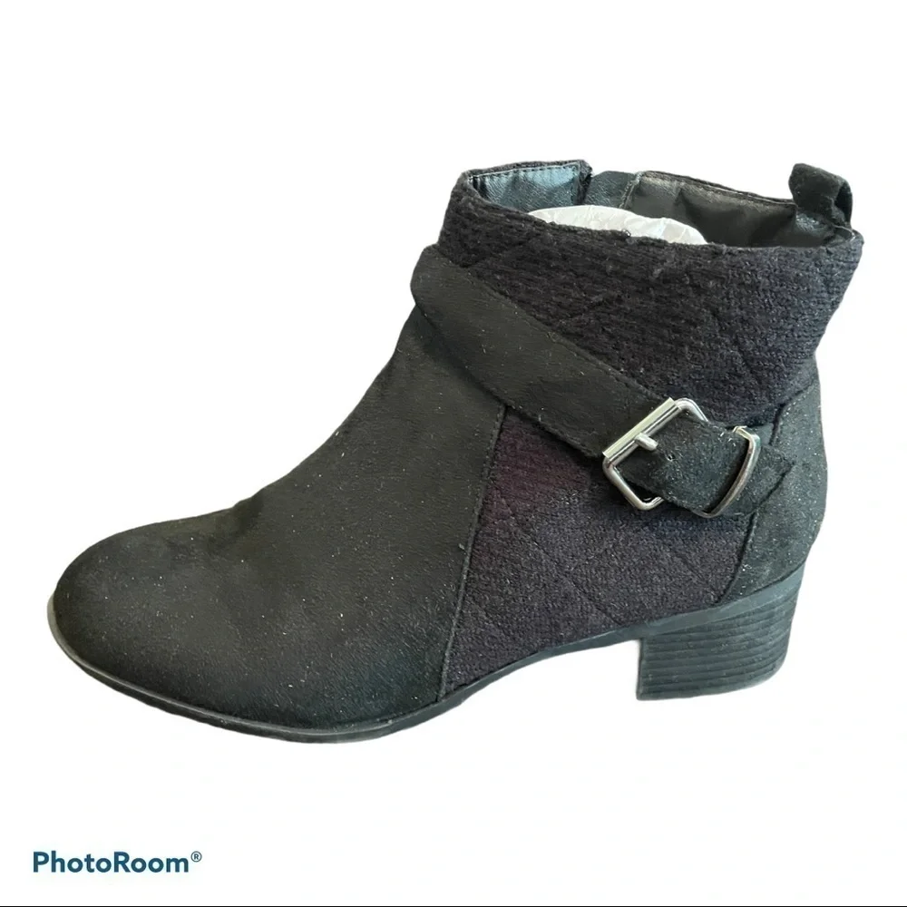 Women’s black ankle boots with buckle accents
